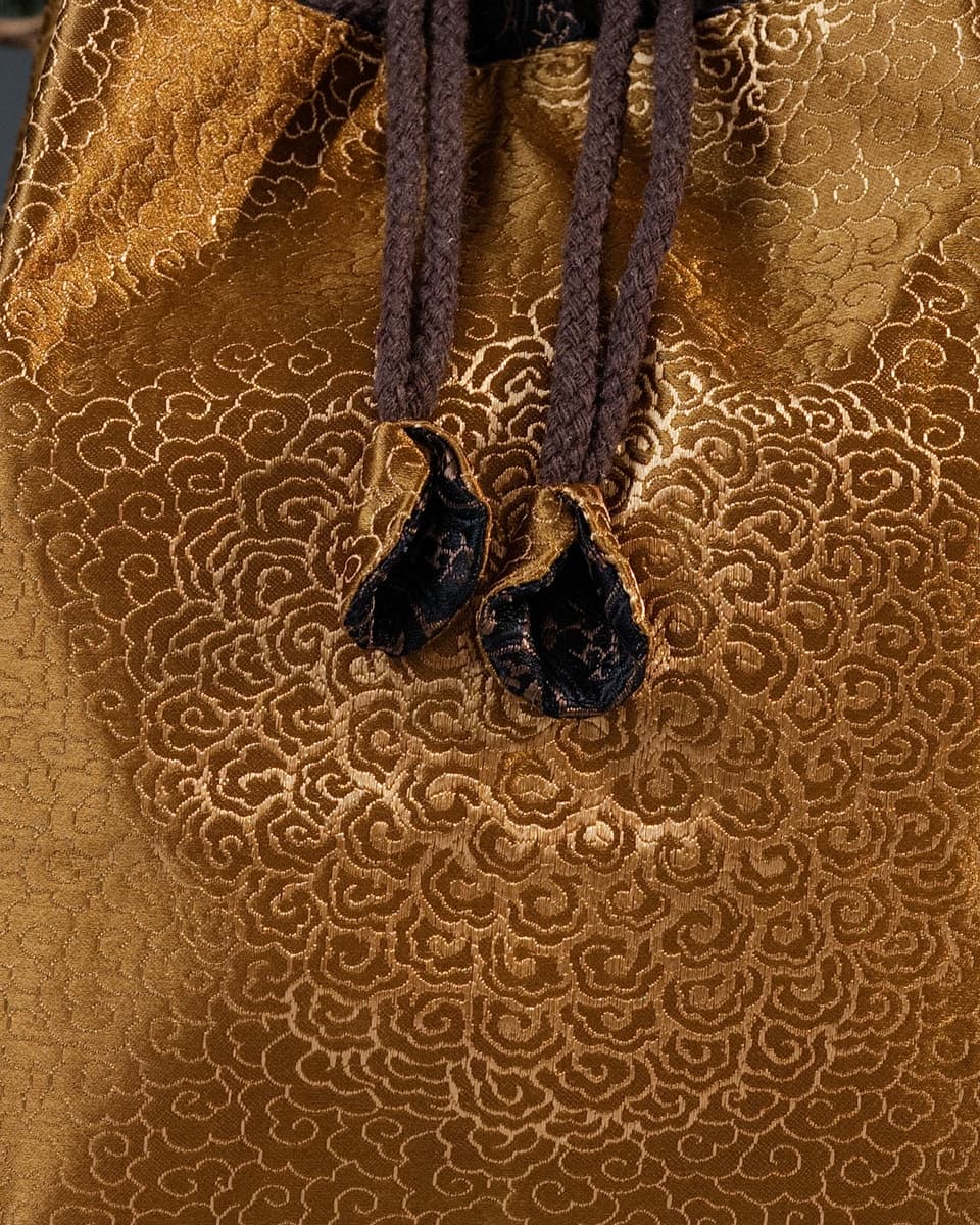 Cloud patterns on a gold Song brocade pouch