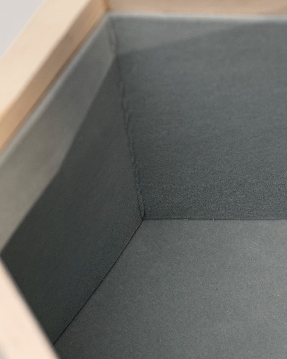 An open Hexagon, lined with velvet