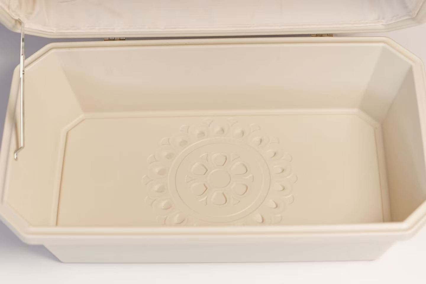 The ring of blessing in relief on the base of the Companion Box